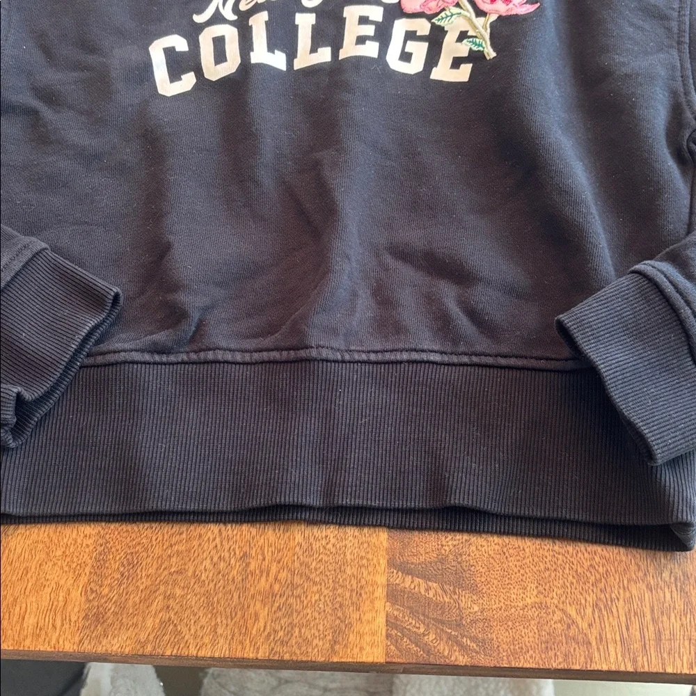 New York College Black Hoodie Sweater with Floral Accent